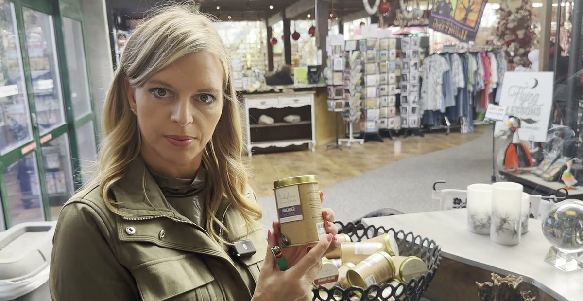 Beaver Bark team member holding a backflow cone tin in store